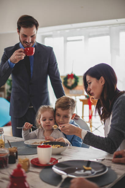 istock Mother feeding her children delicious breakfast 1188367459