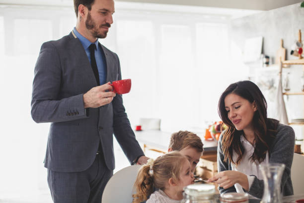 istock Mid adult parents having breakfast with their children before going to work 1188367485