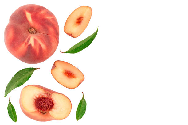 istock Ripe chinese flat peach fruit and half with leaf isolated on white background. Top view. Flat lay 1188367706