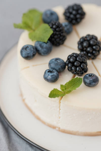 istock fragments of classic cheesecake with fresh berries on a gray background. 1188369280