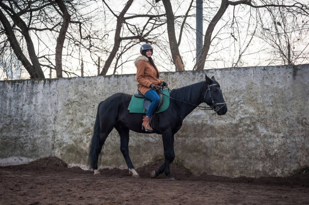 istock Training women and horses while walking on the racetrack 1188369569