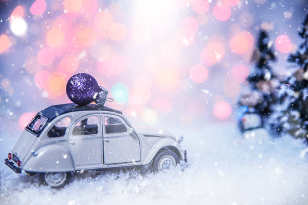 istock Vintage Car Carrying a Christmas Ornament 1188369656