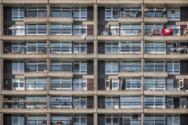 London brutalist style trellick tower block showing exterior and balconies Facade of a Brutalist style tower block, Trellick Tower, in London trellick tower stock pictures, royalty-free photos & images