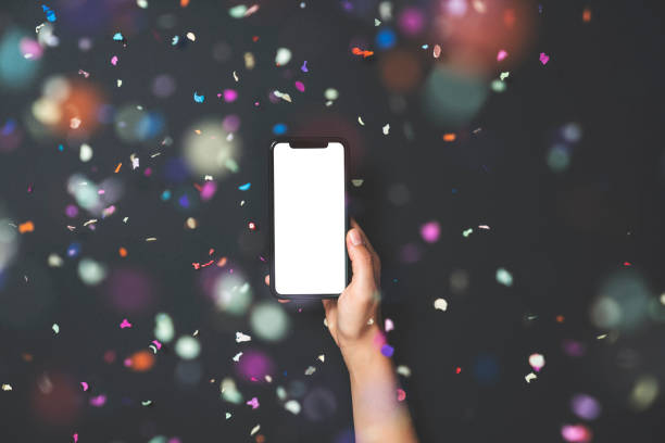 istock Hands holding smart phone on black background 1188372266