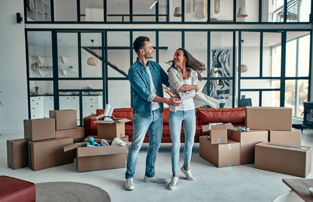 istock Couple moving in new home. 1188372484