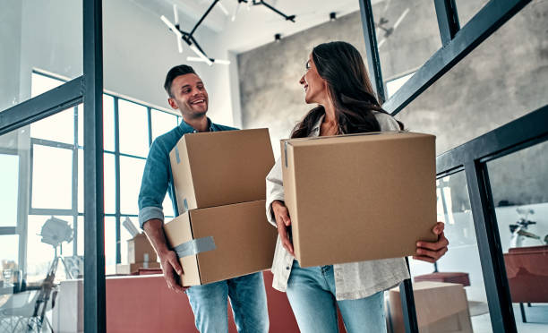 istock Couple moving in new home. 1188372529