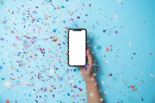 istock Hands holding smart phone on blue background 1188373538