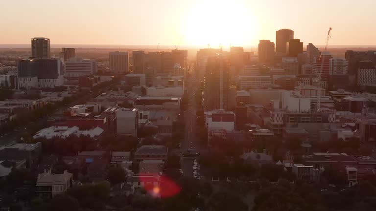 Various aerial shots of Adelaide city near sunset. Lens flare and aeroplane visible in some. South Australia.