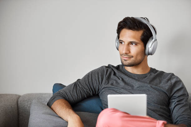 istock Male professional with headphones looking away 1188375385