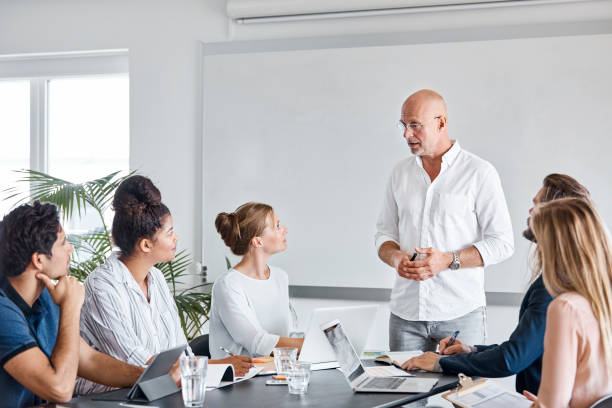 istock Businessman discussing with team in meeting 1188375409