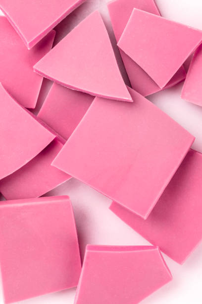 istock Ruby chocolate slices, a close-up overhead shot of a heap on a white background 1188377264