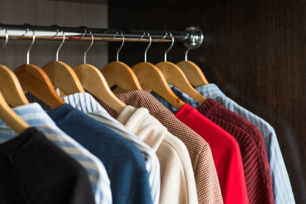istock Hangers with different clothes in wardrobe closet 1188377327