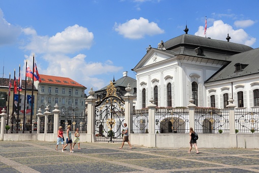 People walk by Presidential Palace in Bratislava, Slovakia. Bratislava is the most populous (462,000) and most visited city in Slovakia.