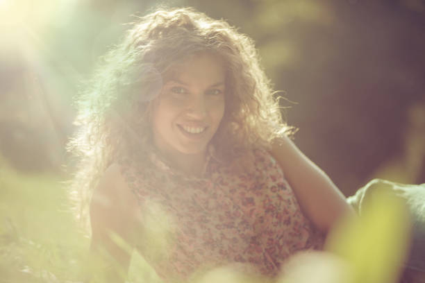 Portrait of cheerful brunette woman outdoors