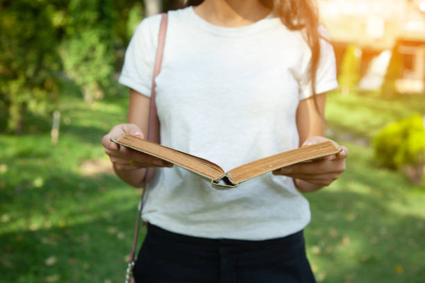 woman hand book in nature