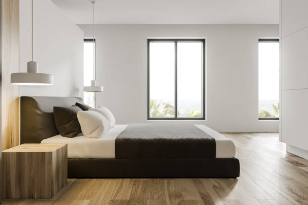 istock Side view of minimalistic white master bedroom 1188382627