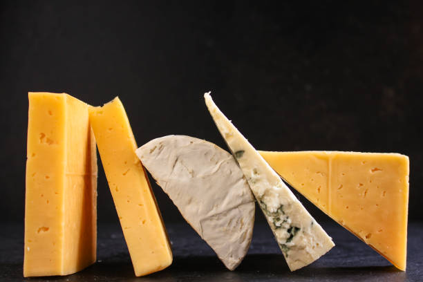 istock cheese, Assorted cheeses on one slate plate - tasting snacks. healthy food. copy space for text and lettering 1188382727