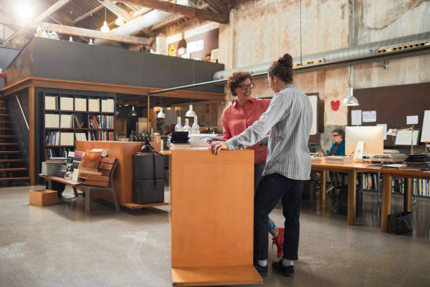 istock Two coworkers standing up meeting. 1188382789
