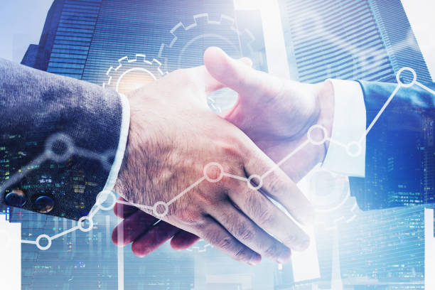 istock Handshake in city, gears and graphs 1188382868