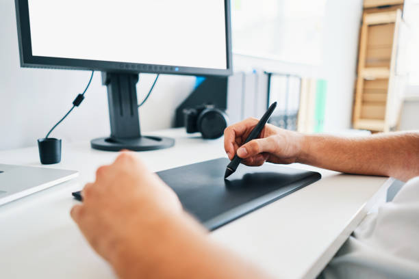 istock Closeup of retoucher, web designer working with tablet 1188382993