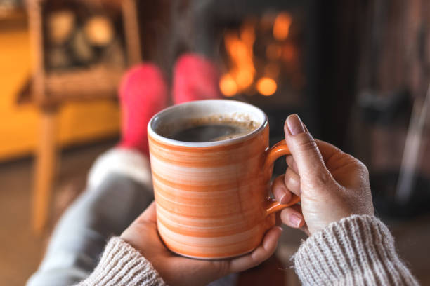 istock Woman relaxing and drinking hot coffee indoors 1188384171
