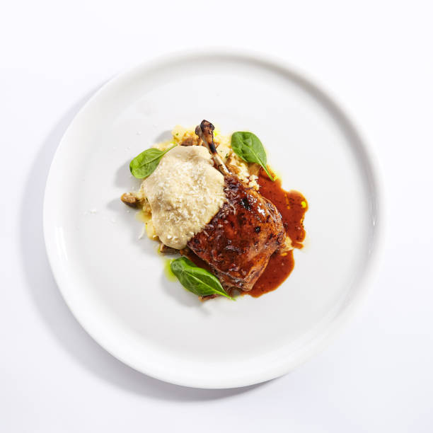 istock Duck leg with millet and hummus dish top view 1188385517