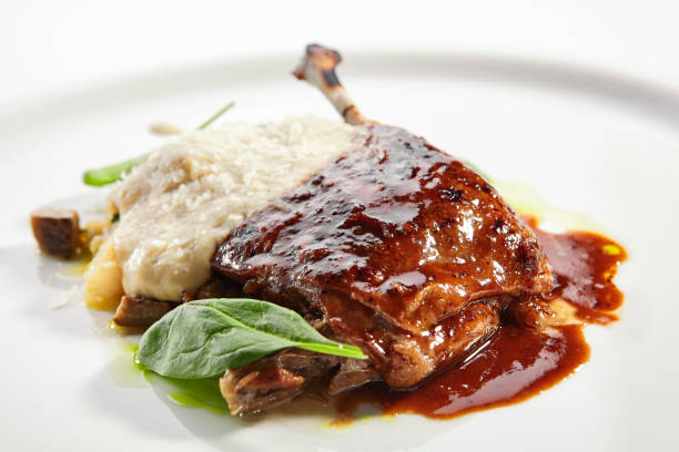 istock Duck leg with millet and hummus dish 1188385554