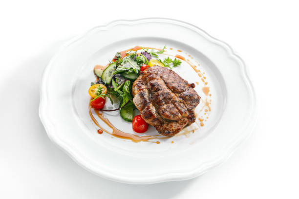 istock Pork Neck Steak with Mixed Salad on White Restaurent Plate 1188385609