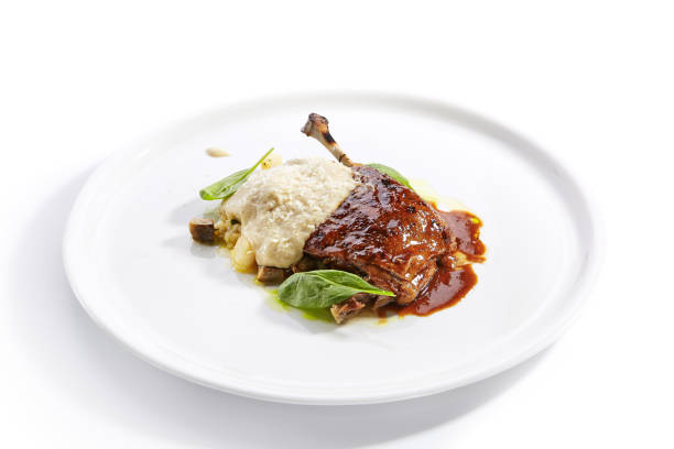 istock Duck leg with millet and hummus dish closeup 1188385628
