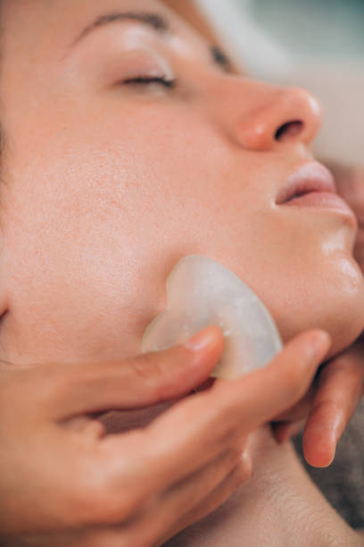 istock Guasha Face Sculpting Technique with Jade Stone in Beauty Salon 1188387798