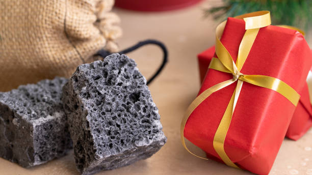 istock Carbon dulce or Sweet coal candy and red Christmas boxes, typical things that bring Tres Reyes Magos  ( Three Wise Men)  for Epiphany or Dia de Reyes Magos. 1188388498