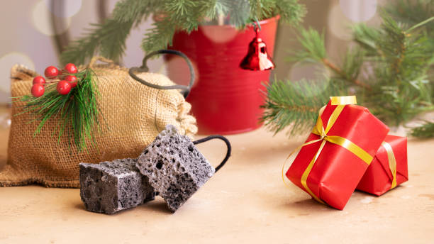 Carbon dulce or Sweet coal candy and red Christmas boxes, typical things that bring Tres Reyes Magos  ( Three Wise Men)  for Epiphany or Dia de Reyes Magos.