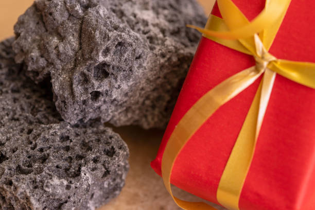 Carbon dulce or Sweet coal candy and red Christmas boxes, typical things that bring Tres Reyes Magos  ( Three Wise Men)  for Epiphany or Dia de Reyes Magos.