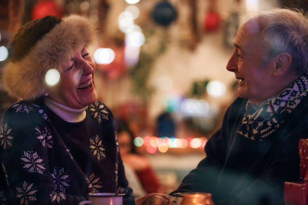 istock Cheerful senior couple having a laugh while enjoying warm tea in a cafe 1188389155
