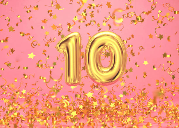 numero 10 d'oro con coriandoli che cadono su sfondo rosa - gold confetti star shape nobody foto e immagini stock