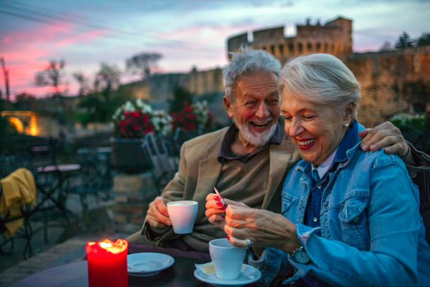 istock Senior Couple Enjoying Cappuccino In Rooftop Cafe 1188390788