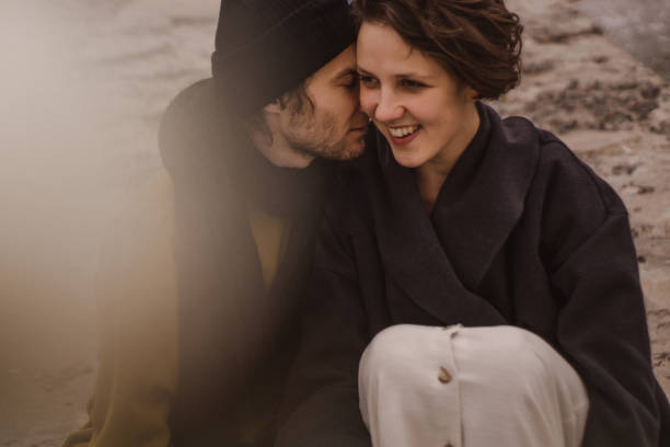 istock Romantic couple having fun on the beach. Happy couple running on beach 1188392113