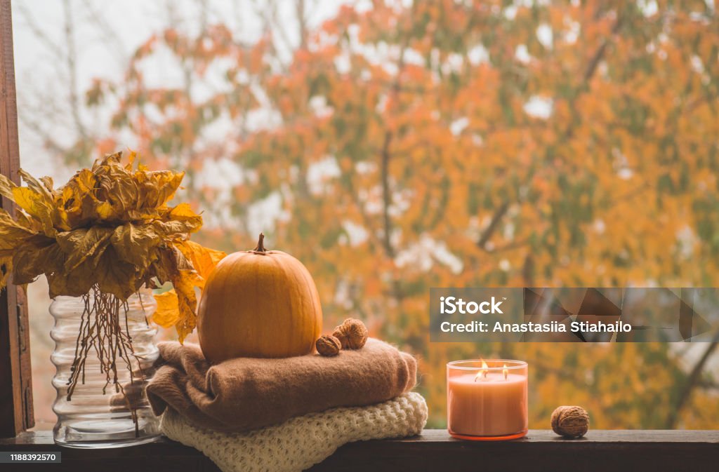 Still life details in home on a wooden window. Autumn decor on a window Sweet Home. Still life details in home on a wooden window. Autumn decor on a window. Cozy autumn or winter concept. Autumn Stock Photo