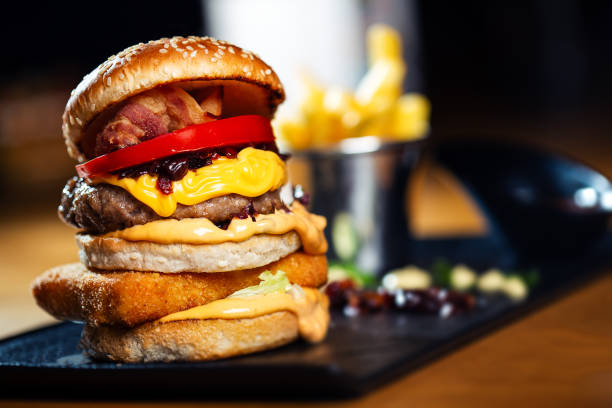 istock Close up to beef burger with cheese and vegetables 1188393465