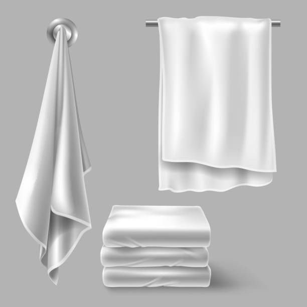 Mockup with white cloth towels White cloth towels on hangers and folded in stack. Vector realistic mockup of fabric towels for bathroom, spa hotel, beach or kitchen isolated on gray background washcloth stock illustrations