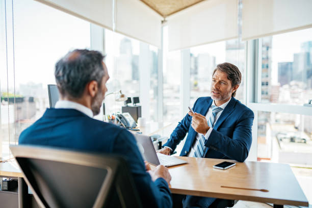 istock Mature businessmen in office 1188395724