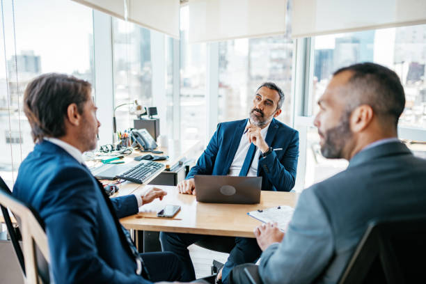 istock Mature businessmen in office, manager making decisions with advisers 1188396477