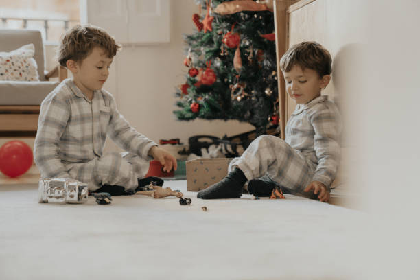 istock Brothers opening Christmas gifts 1188396484