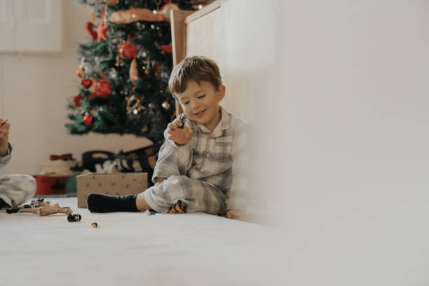 istock Brothers opening Christmas gifts 1188396487