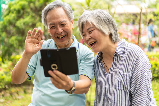 istock Senior couple having video call on mobile phone 1188400061