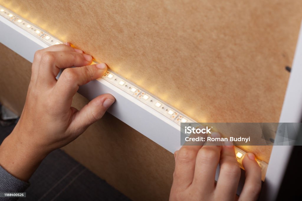 diode lighting installation,installation of LED strip warm spectrum diode lighting installation,installation of LED strip warm spectrum . LED Light Stock Photo