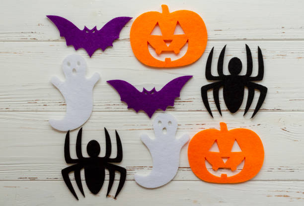 istock felt pumpking, spider, ghost, bat on wooden background 1188401129