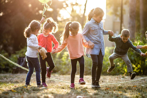 istock Group of children playing in public park 1188401845