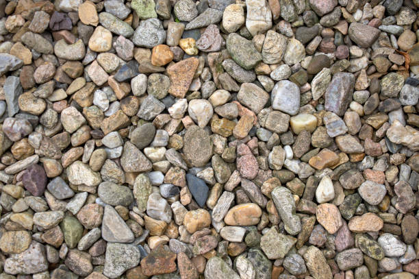 istock Group of pebbles, light colors, stone background, round and smooth pebbles, simple and harmony texture 1188403457