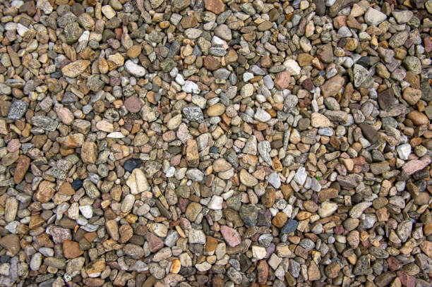 istock Group of pebbles, light colors, stone background, round and smooth pebbles, simple and harmony texture 1188403528